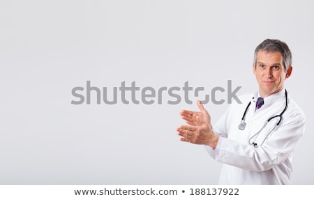 Сток-фото: Middle Aged Doctor Gesturing With Copy Space