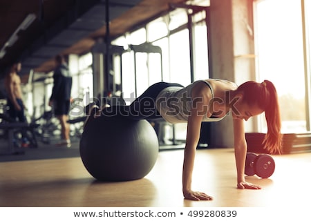[[stock_photo]]: Young Woman With Ball Exercising On White