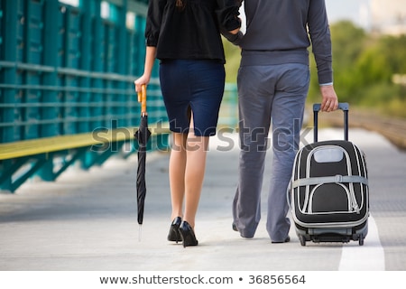 Attractive Girlfreinds Carrying The Umbrellas Сток-фото © Pressmaster