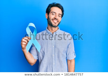 ストックフォト: Smiling Man With Prostate Cancer Awareness Ribbon