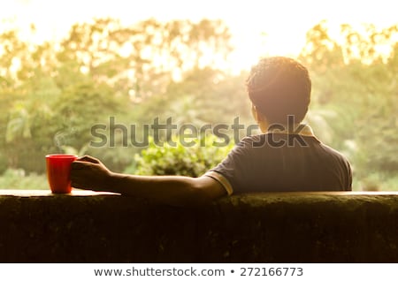 Stok fotoğraf: Man Having Black Coffee In Garden