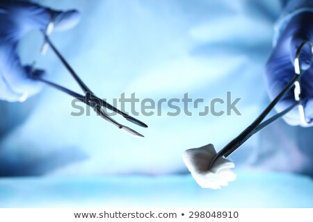 Сток-фото: Surgeon Holding Surgical Tool In Operation Theater