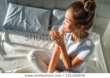 Stock fotó: Woman Drinking Glass Of Milk At Home