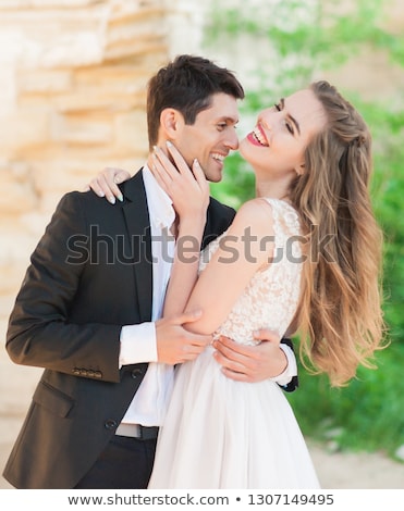 Stok fotoğraf: Bride And Groom Embrace Each Other