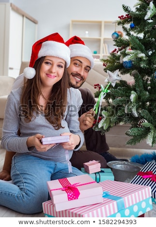 Stockfoto: Husband Giving Christmas Present To Pregnant Wife