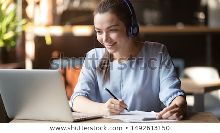 Stockfoto: The Young Female Student Preparing For Exams At Home