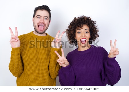 [[stock_photo]]: Image Of Optimistic Couple In Casual Wear Smiling And Gesturing