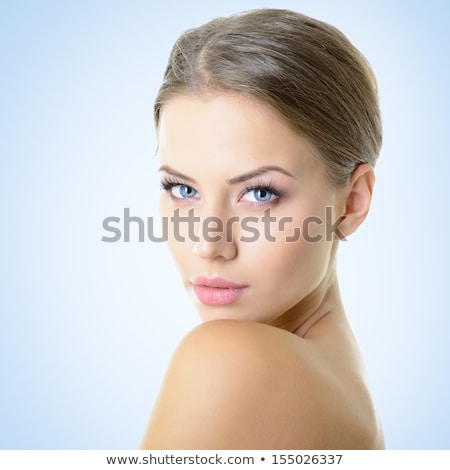 Stock photo: Beautiful Young Woman With Healthy Skin Posing Isolated Over Pink Background Looking Aside