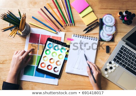 Stock photo: Young Woman Dressmaker Or Designer Working Choose Color Bar In T