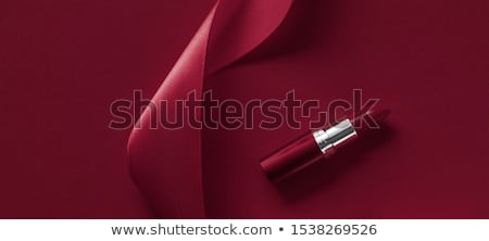 Stock foto: Luxury Lipstick And Silk Ribbon On Maroon Holiday Background Ma