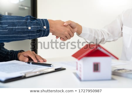 Stockfoto: House Developers And Customer Shaking Hand After Finish Buying O