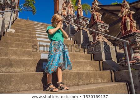 Stockfoto: Young Boy Tourist In Budhist Temple Brahma Vihara Arama Bali