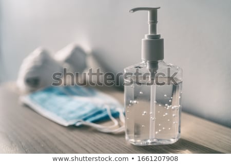 Foto stock: Coronavirus Corona Virus Prevention Travel Surgical Masks And Hand Sanitizer Gel For Hand Hygiene Sp