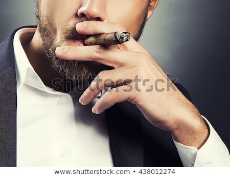 Stock fotó: Man Smoking Cigar