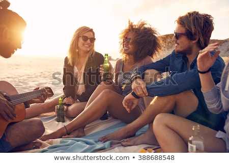 Foto d'archivio: Happy Woman With Bottle Of Drink On Summer Beach