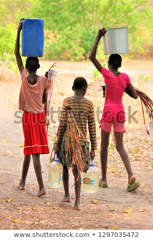 Zdjęcia stock: Young Girl Carrying The Washing