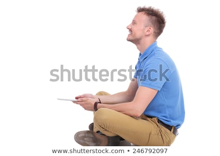 Foto stock: Side View Of A Happy Casual Man With Hands Crossed