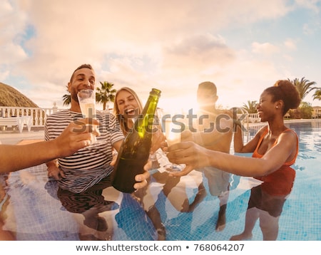 Foto stock: Woman Having Champagne At Summer Party