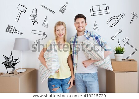 Сток-фото: Couple With Pillow And Lamp Moving To New Home