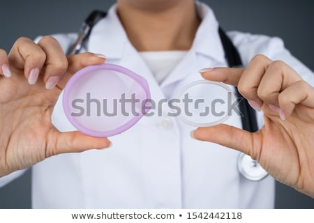 Stock photo: Woman Holding Vaginal Ring