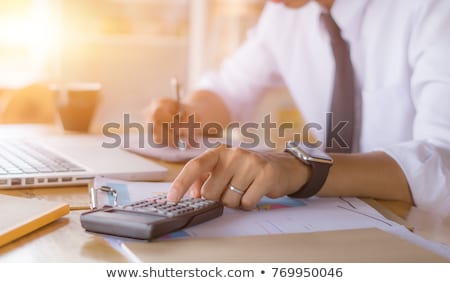 Foto stock: Businessman Calculating Expense In Office