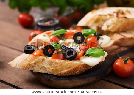 Foto d'archivio: Bruschetta With Olive And Garlic Pesto With Cherry Tomato And P