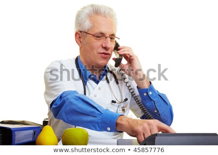 Stockfoto: Male Doctor Making Telephone Call