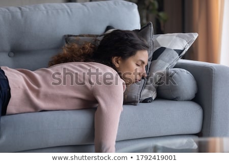 [[stock_photo]]: Woman Sleeping On Sofa