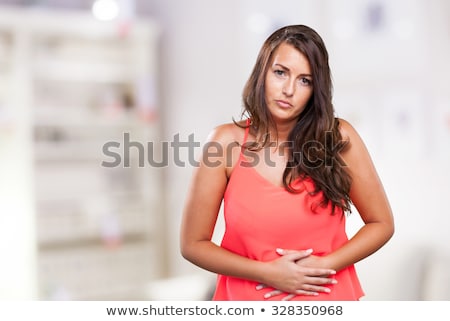 Stock foto: Woman With Hands On Stomach Having Bad Aches Pain