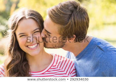 Stock photo: Loving Couple Kissing In The Park