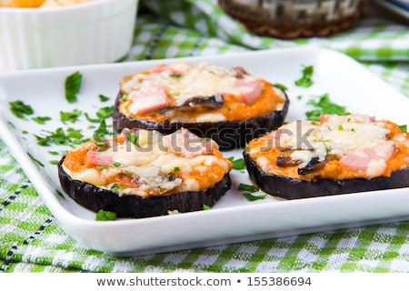 Сток-фото: Baked Eggplant Sliced With Ham And Tomato