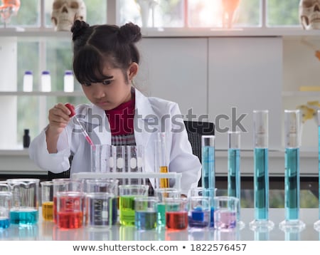 Stock foto: Girl With Test Tube Studying Chemistry At School