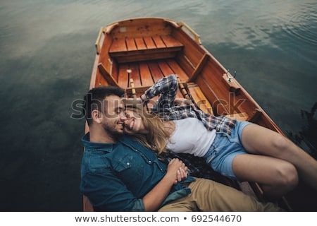 Zdjęcia stock: Loving Couple Rowing On The Lake