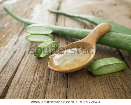 Stock foto: Aloe Vera Leaves And Slices On Wooden Table Closeup Natural Tr