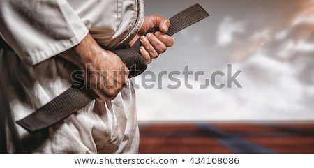 Stockfoto: Man Practicing Judo Against A Blue Sky