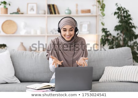Foto stock: Woman Calling While Gesturing On A Living Room