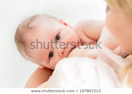 Stok fotoğraf: Close Up Of Mother Breast Feeding Adorable Baby