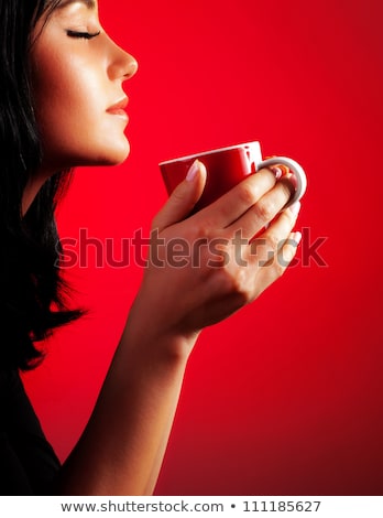 [[stock_photo]]: Side View Portrait Of A Woman Drinking Coffee