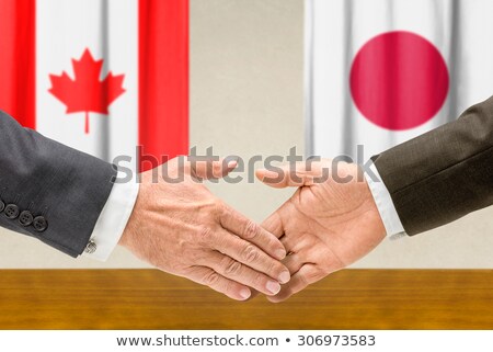 ストックフォト: Representatives Of Canada And Japan Shake Hands