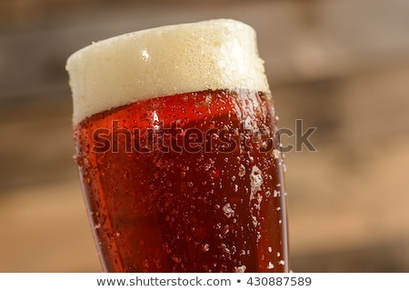 Stock fotó: The Beer Red Ale On A Dark Background