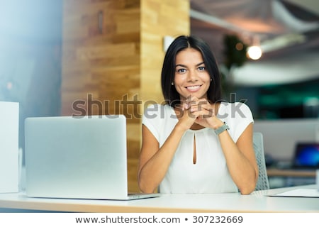 ストックフォト: A Business Woman Sitting At A Desk