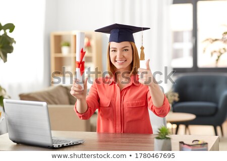 Foto stock: Student With Diploma At Home Showing Thumbs Up