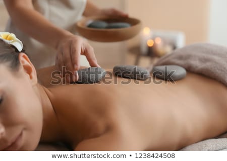 Foto stock: Young Woman Having A Hot Stone Massage