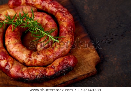 Stockfoto: Grilled Or Roasted Spiral Pork Sausages With Rosemary Salt And Peper