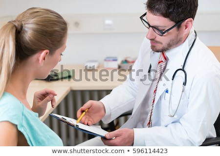 Zdjęcia stock: Gynecologist In His Doctors Office Seeing A Patient