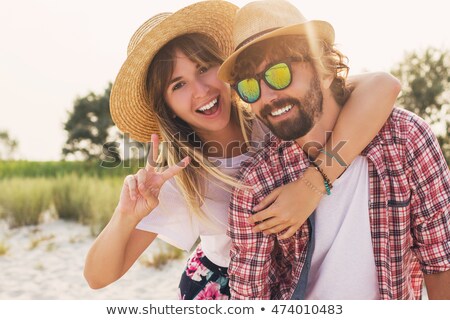 Stok fotoğraf: Couple Wearing Straw Hats