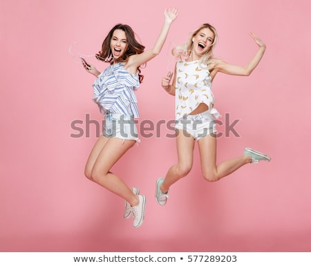 Foto stock: Young Woman Enjoying Music Over Headphones