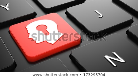 Foto stock: Head With A Keyhole Icon On Red Keyboard Button
