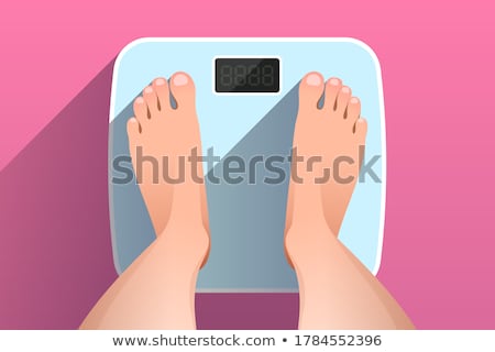 ストックフォト: Female Feet On Bathroom Scales