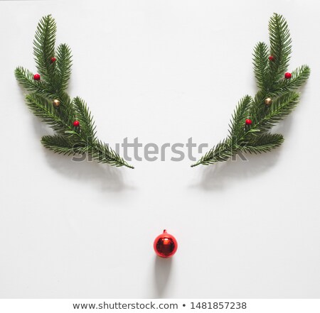 Stockfoto: Red Christmas Reindeer Ornament In Pine Tree